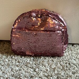 Pink sequin clutch or make up bag